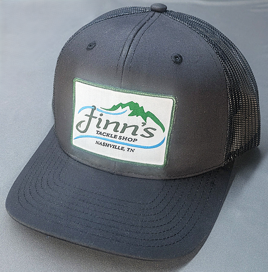 It’s black in color for those who spend their nights on the water and then wake up next to a campsite that lingers with the smell of fish and bad decisions.&nbsp; This hat will impress absolutely no one except the other person still sleeping next to you.&nbsp; Let everyone know that the only thing classy about you is where you shop for your tackle.&nbsp; Finn’s Tackle Shop.